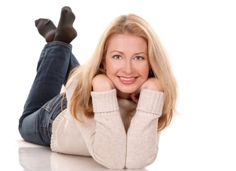 pretty blond woman wearing beige top sitting on white background