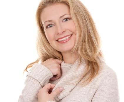pretty blond woman wearing beige sweather on white background