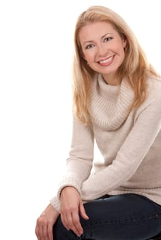 pretty blond woman wearing beige sweather on white background