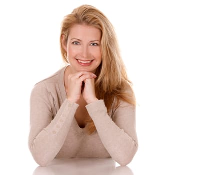 pretty blond woman wearing beige top sitting on white background