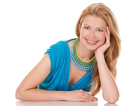 classy blond woman in her 40s wearing turquois dress