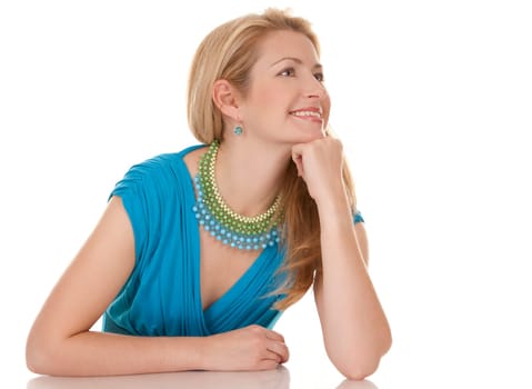 classy blond woman in her 40s wearing turquois dress