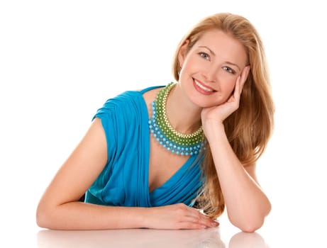 classy blond woman in her 40s wearing turquois dress