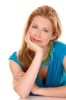 classy blond woman in her 40s wearing turquois dress