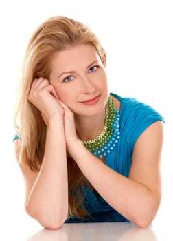 classy blond woman in her 40s wearing turquois dress