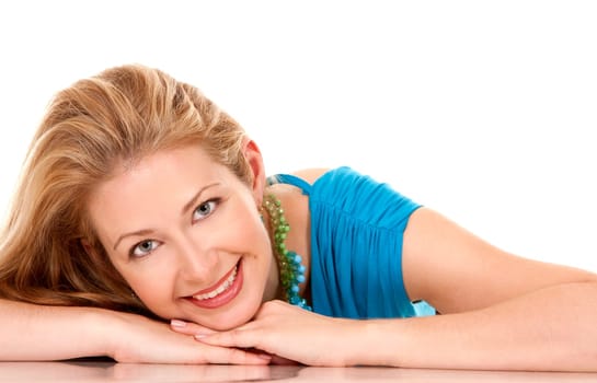 classy blond woman in her 40s wearing turquois dress