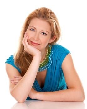 classy blond woman in her 40s wearing turquois dress