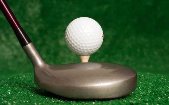 A golf club prepares to drive the ball