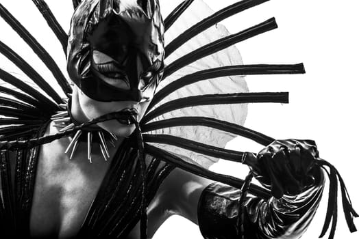 one caucasian woman in catwoman leather latex with whip  in silhouette studio isolated on white background