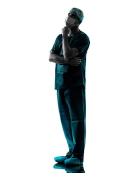 one caucasian man doctor surgeon thinking medical worker with face mask full length silhouette isolated on white background