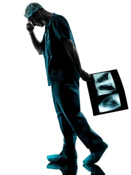 one caucasian man doctor surgeon radiologist medical worker silhouette isolated on white background