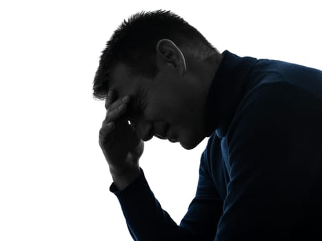 one caucasian man headache pain portrait in silhouette studio isolated on white background