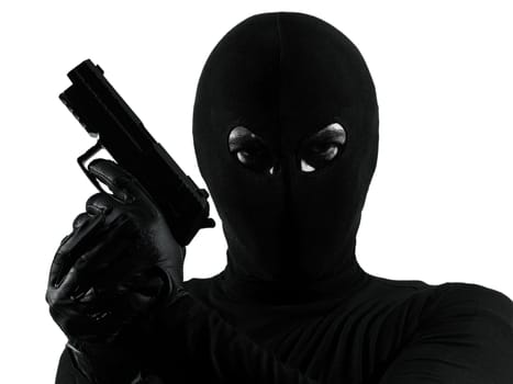 thief criminal terrorist holding gun portrait in silhouette studio isolated on white background