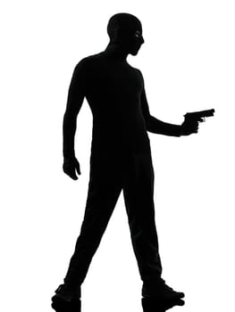 thief criminal terrorist man aiming gun in silhouette studio isolated on white background