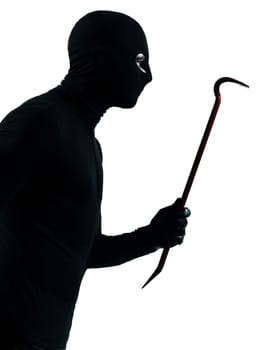 thief criminal holding crowbar portait in silhouette studio isolated on white background