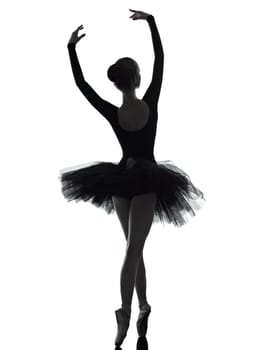one caucasian young woman ballerina ballet dancer dancing with tutu in silhouette studio on white background