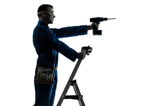 one caucasian man construction worker holding drill silhouette in studio on white background