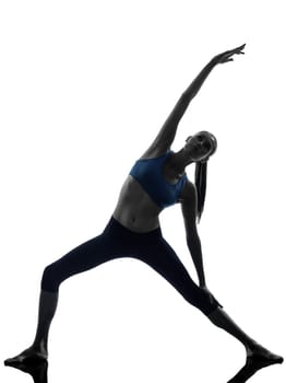 one caucasian woman exercising stretching triangle pose yoga in silhouette studio isolated on white background
