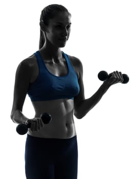 one caucasian woman exercising yoga  weight training in silhouette studio isolated on white background