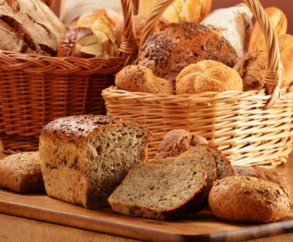 Composition with bread and rolls in wicker basket