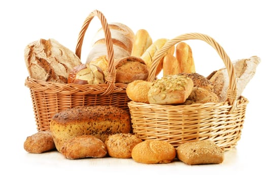 Composition with bread and rolls in wicker basket isolated on white