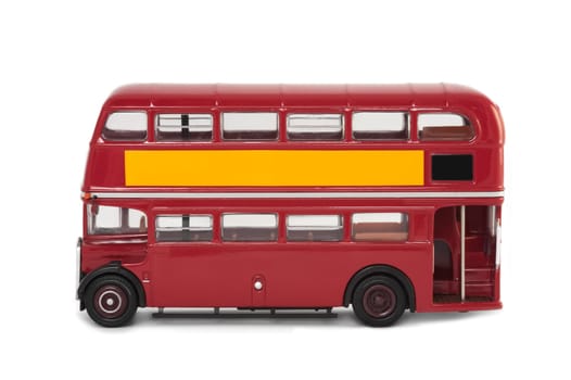 miniature scale model of a vintage red london bus on white with copy-space