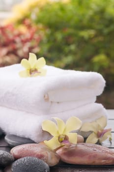 Spa concept with orchids and river stones outdoor