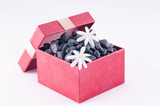 Spa concept - a gift of wellness with black zen stones