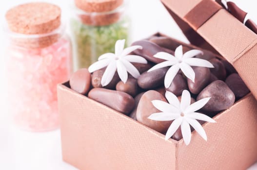 Spa concept - a gift of wellness with red zen stones
