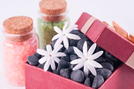 Spa concept - a gift of wellness with black zen stones