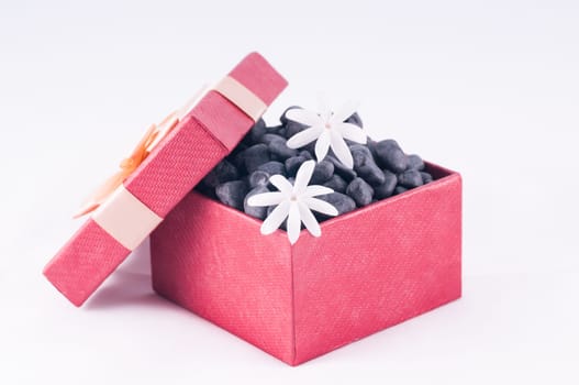 Spa concept - a gift of wellness with black zen stones