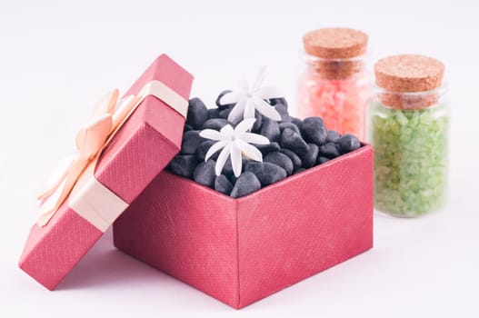 Spa concept - a gift of wellness with black zen stones