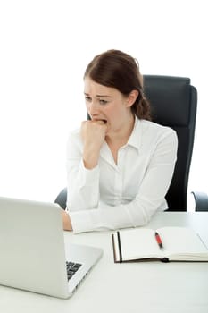 young business woman is afraid in front of laptop white background