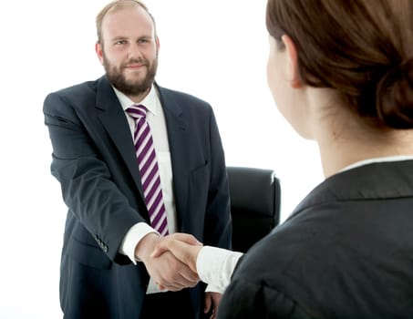 beard business man brunette woman desk handshake