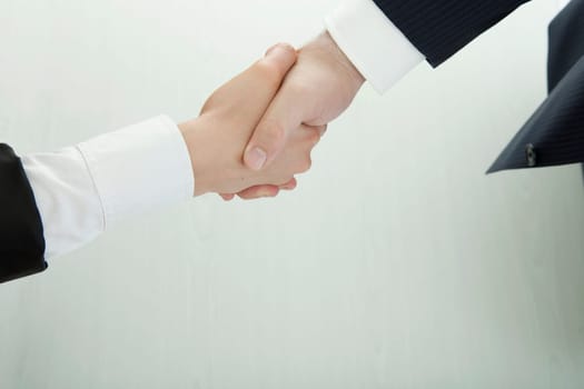 handshake of business man and woman in suit