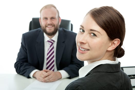 beard business man brunette woman at desk smile
