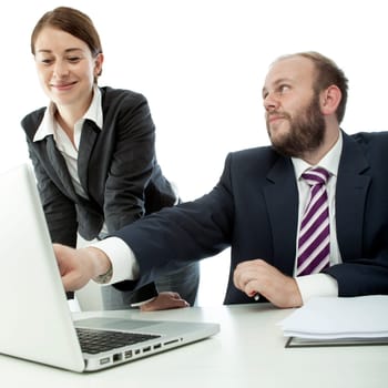 beard business man brunette woman at desk point at laptop