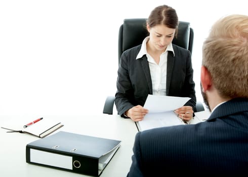 beard business man brunette woman at desk read application