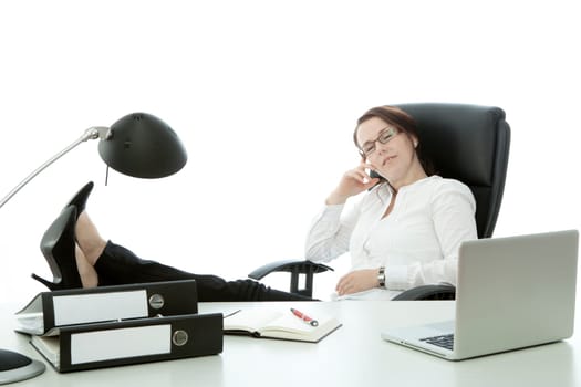 young brunette businesswoman with glasses relax with feet on desk