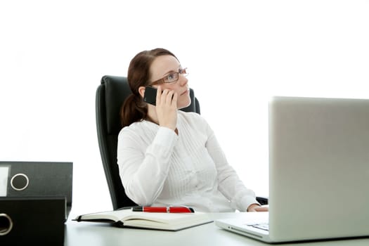 young brunette business woman and cell phone on desk