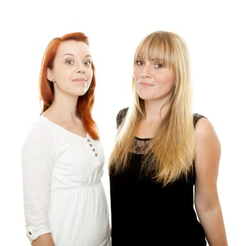 young beautiful red and blond haired girls in front of white background