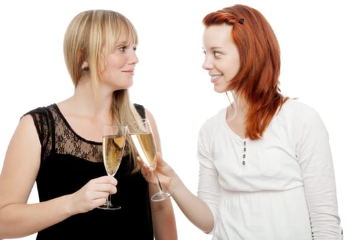 young beautiful red and blond haired girls in front of white background