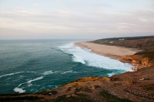 Scenic view of surf beach and ocean near Nazare Portugal
