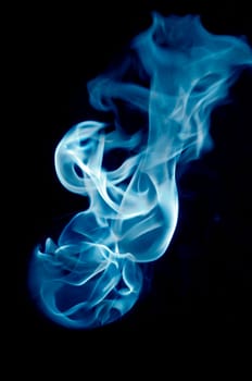 bluish fire with a black background, abstract background.