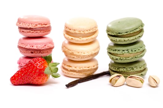 Three different French macarons with strawberry,vanilla and pistachios