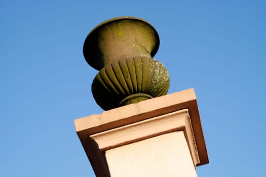 Column with vase in a park