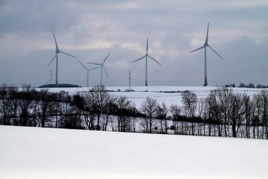 Winter landscape with wind turbine