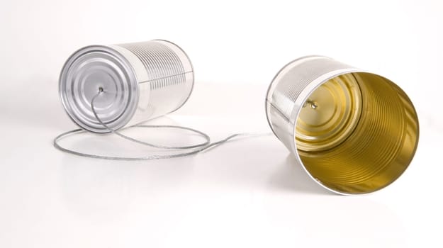 Two cans wired together somehow transfers audio to the other side