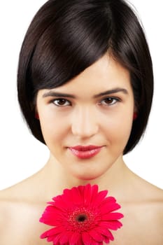Portrait of a beautiful young woman with a flower in her hair isolated on white.