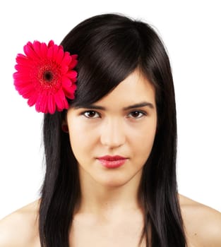 Portrait of a beautiful young woman with a flower in her hair isolated on white.
